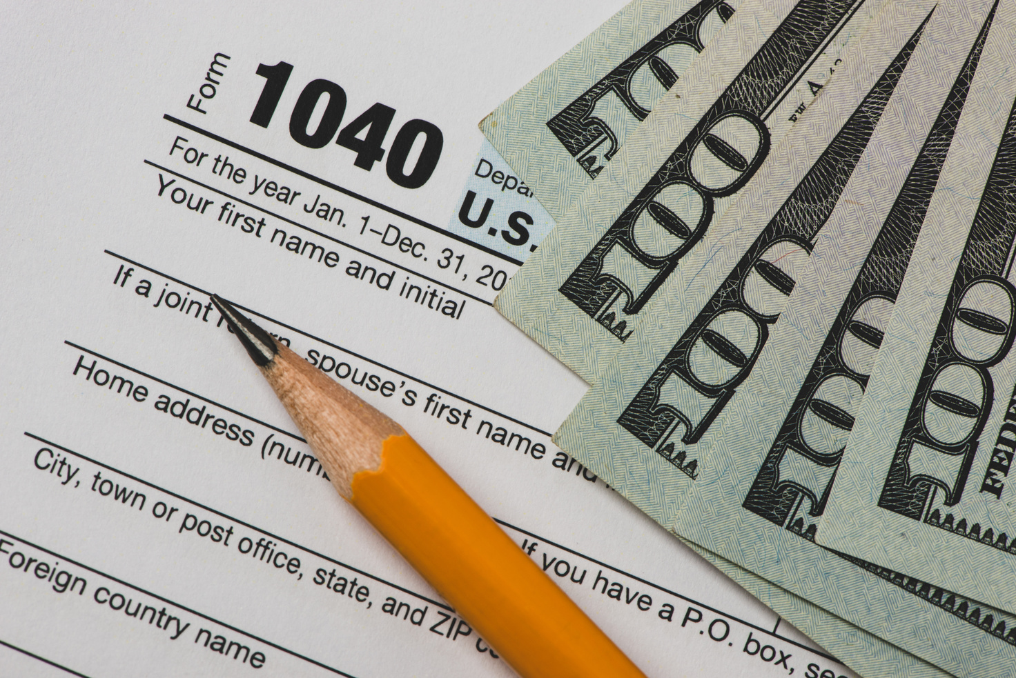 Tax Refund concepts. Tax Refund characters and US currency notes. Tax Return. Filling tax information.